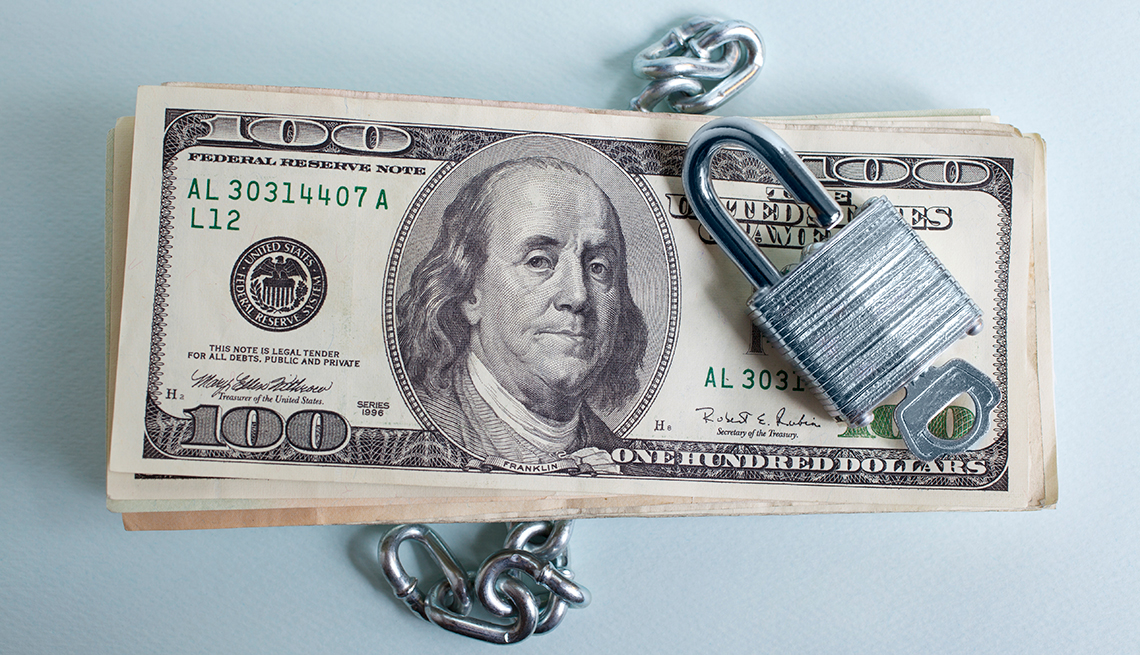 100 dollar bills, chain, lock, economic security, AARP Research, Topics and Issues