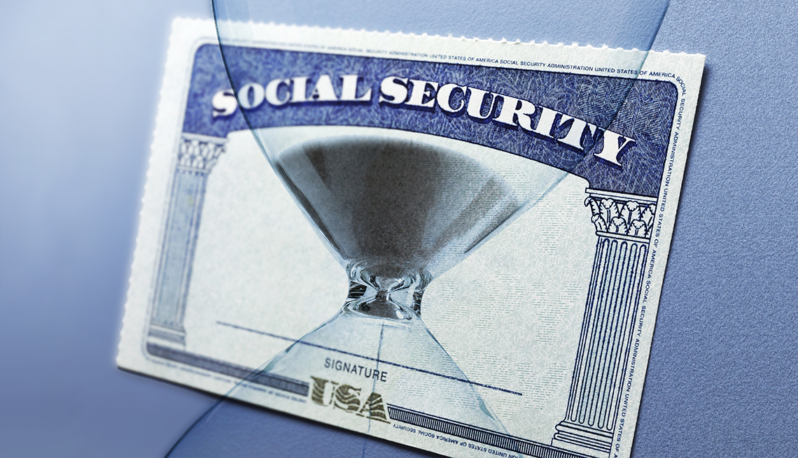 hourglass montaged on top of a social security card.